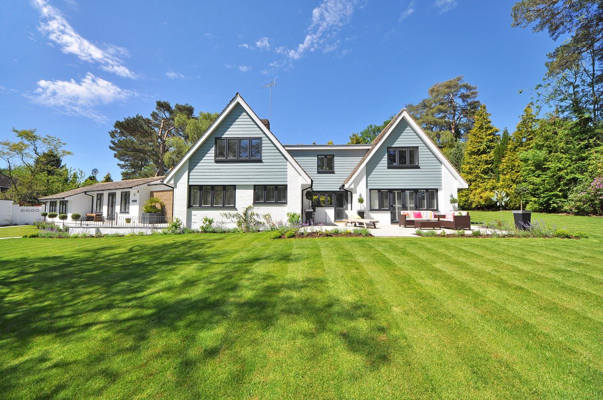 Stone and brick house with a front walk