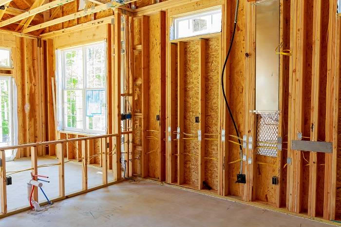 Rough electrical wiring in open wall studs before drywall