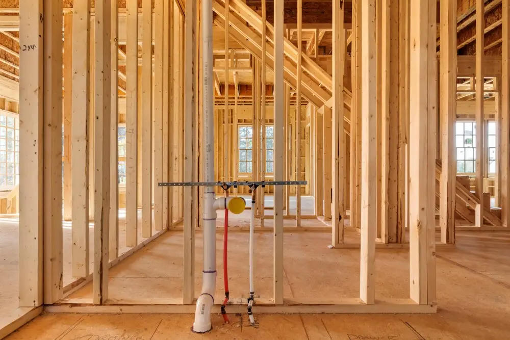 Plumbing stack and supply lines in open framing before drywall
